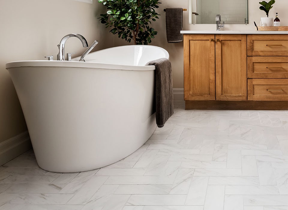 Bathroom with tile flooring and freestanding tub in London Ontario