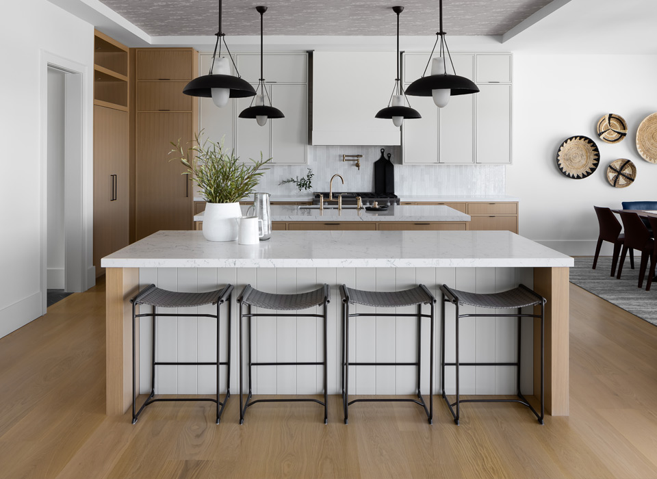 Modern kitchen with light hardwood flooring in a London Ontario home