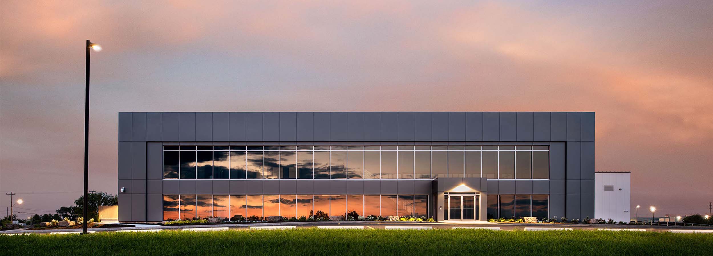 a group of construction workers looking at plans