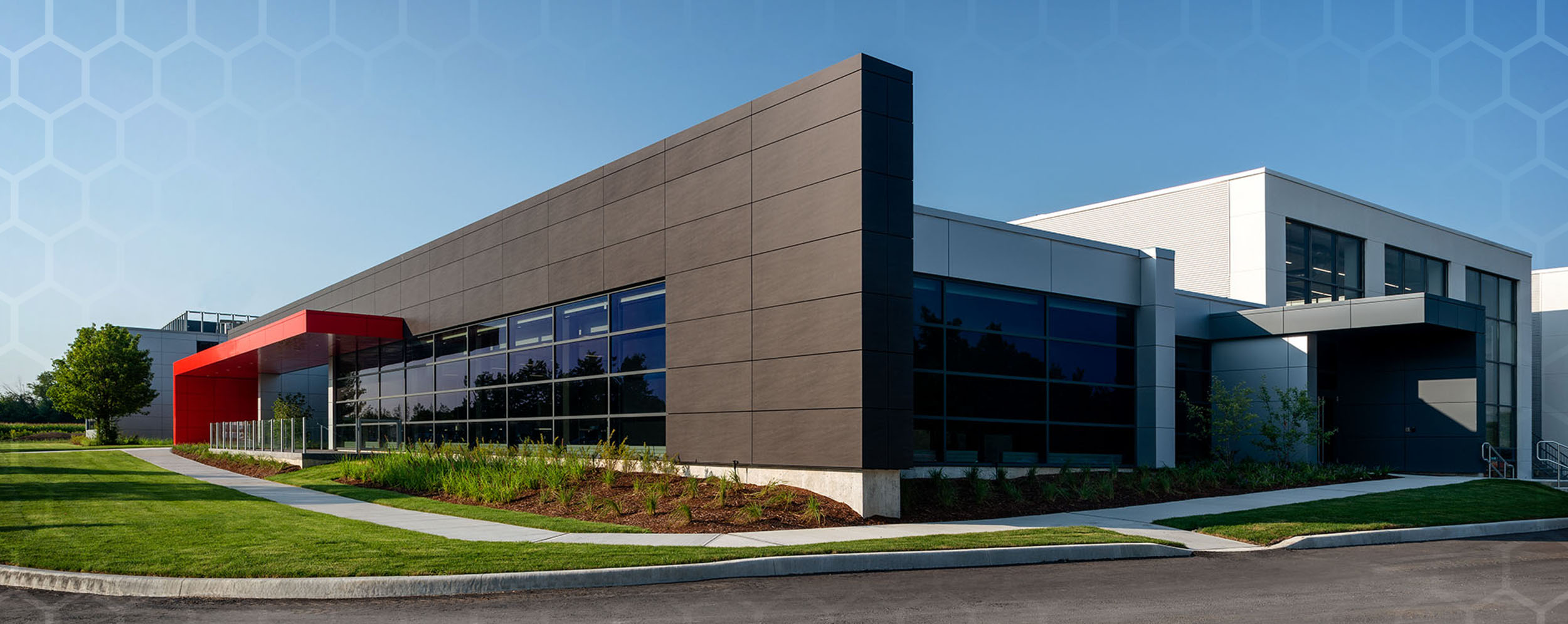 Starlim expansion showing a view of the front and side of the building which has brown and white exterior walls.