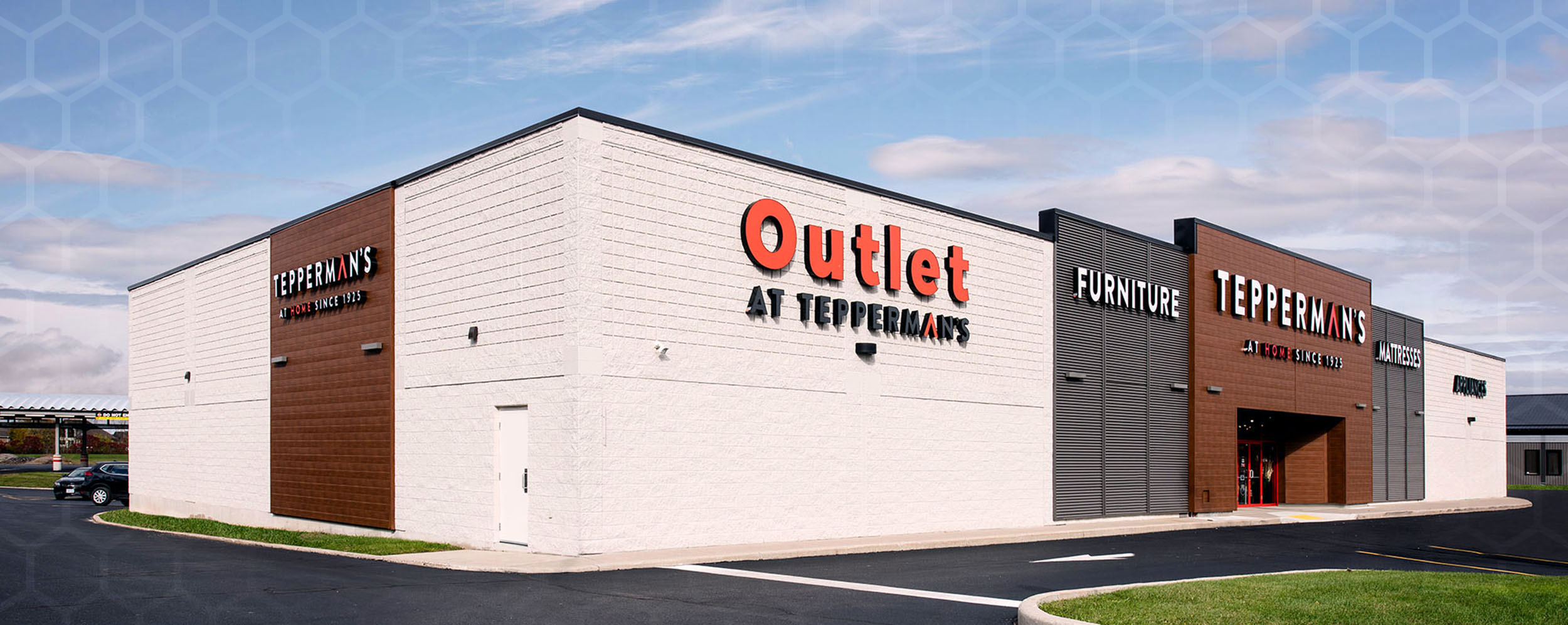 Teppermans in Chatham, commercial renovation construction project, White Building with brown and grey accents with red and white writing