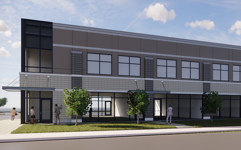 Exterior view of Wellington Commons, side of building showing 2 floors with large tall windows on the bottom floor that are on both sides of the building so you can see through the space.