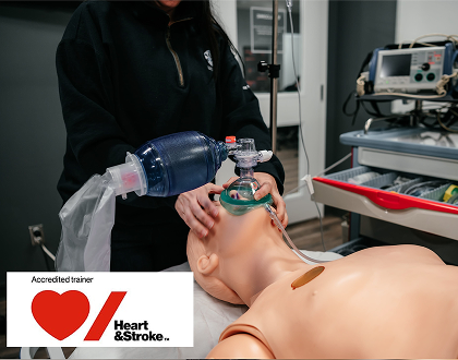 A Mosaic Medical employee instructing a class of students how to use a respirator.