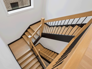 Multi-level staircase with quarter-turn landing in Ontario home